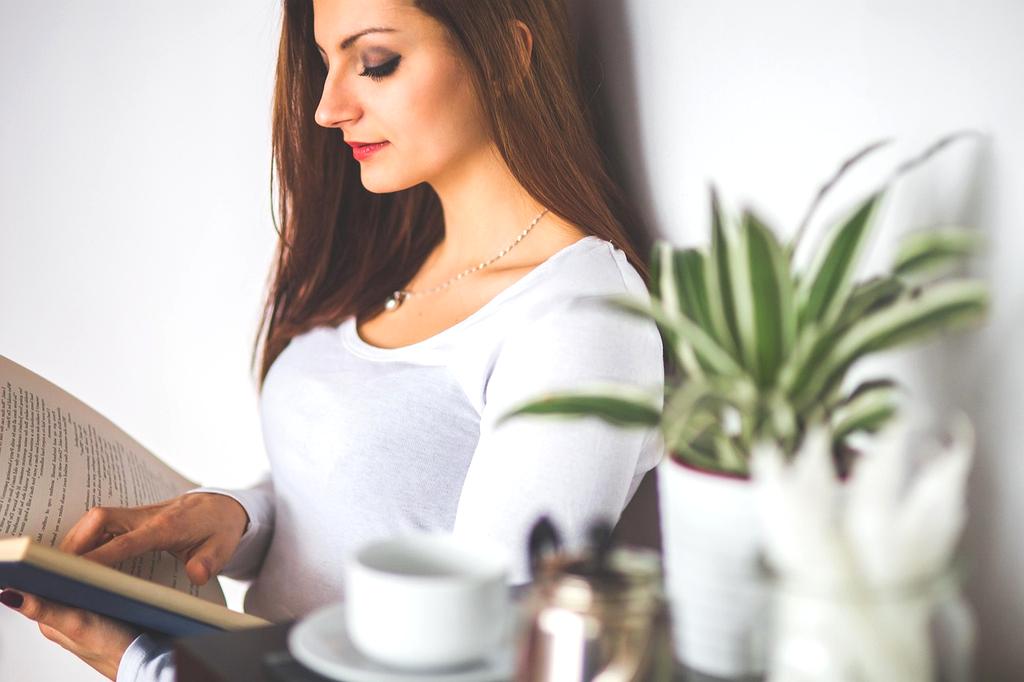 A person meditating in a sunlit room
